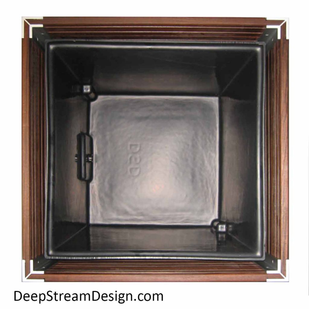 A studio photo looking straight down inside a square wood planter showing how the waterproof liner sits inside on a hidden structural aluminum frame.