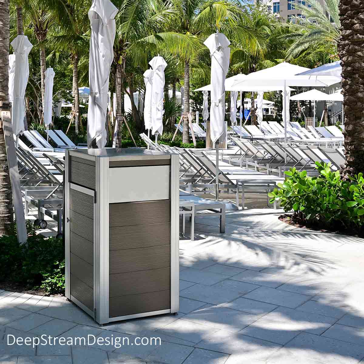 A 5-star resort's tropical waterpark with private cabanas and rows and rows of sunbeds around one of the many lazy rivers and tropical pools uses DeepStream’s weatherproof, maintenance-free, high-volume Oahu Modern Commercial Recycling and Trash Bins crafted with Aged Hardwood recycled plastic lumber, 316 stainless steel lid and hinges, ergonomic side door for bag changes, and marine aluminum push flaps to withstand both the weather and the hundreds of thousands of visitor touches every year, while maintaining their like-new appearance.