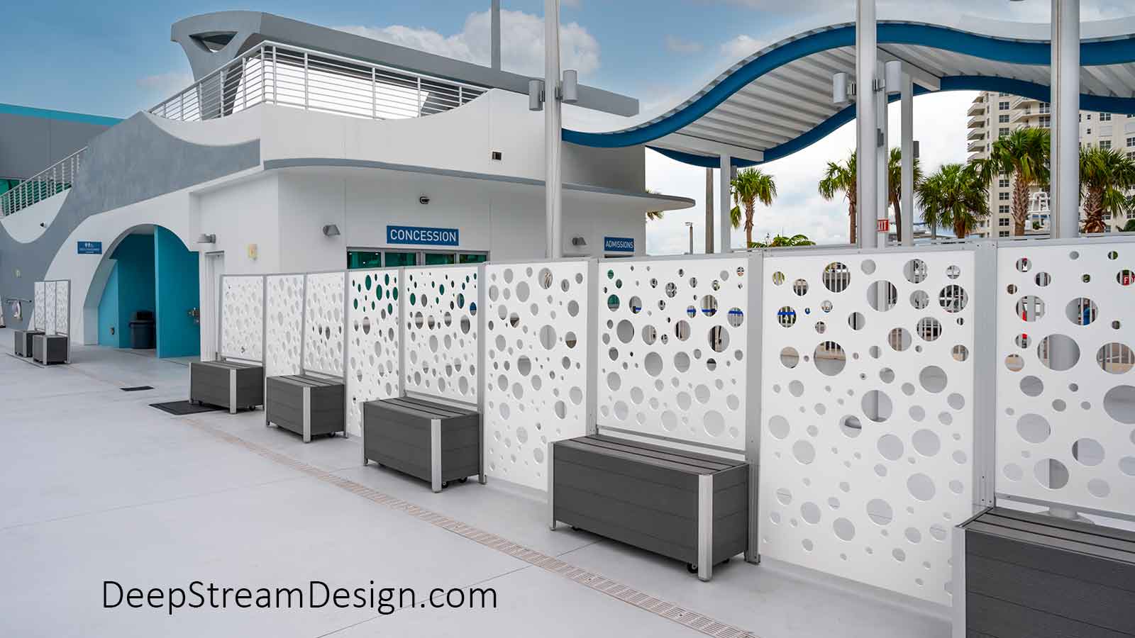 Moveable modern gray, no maintenance, recycled plastic lumber modular Bench on Casters, and mounted with white HDPE plastic Screen Wall with a bubble pattern.