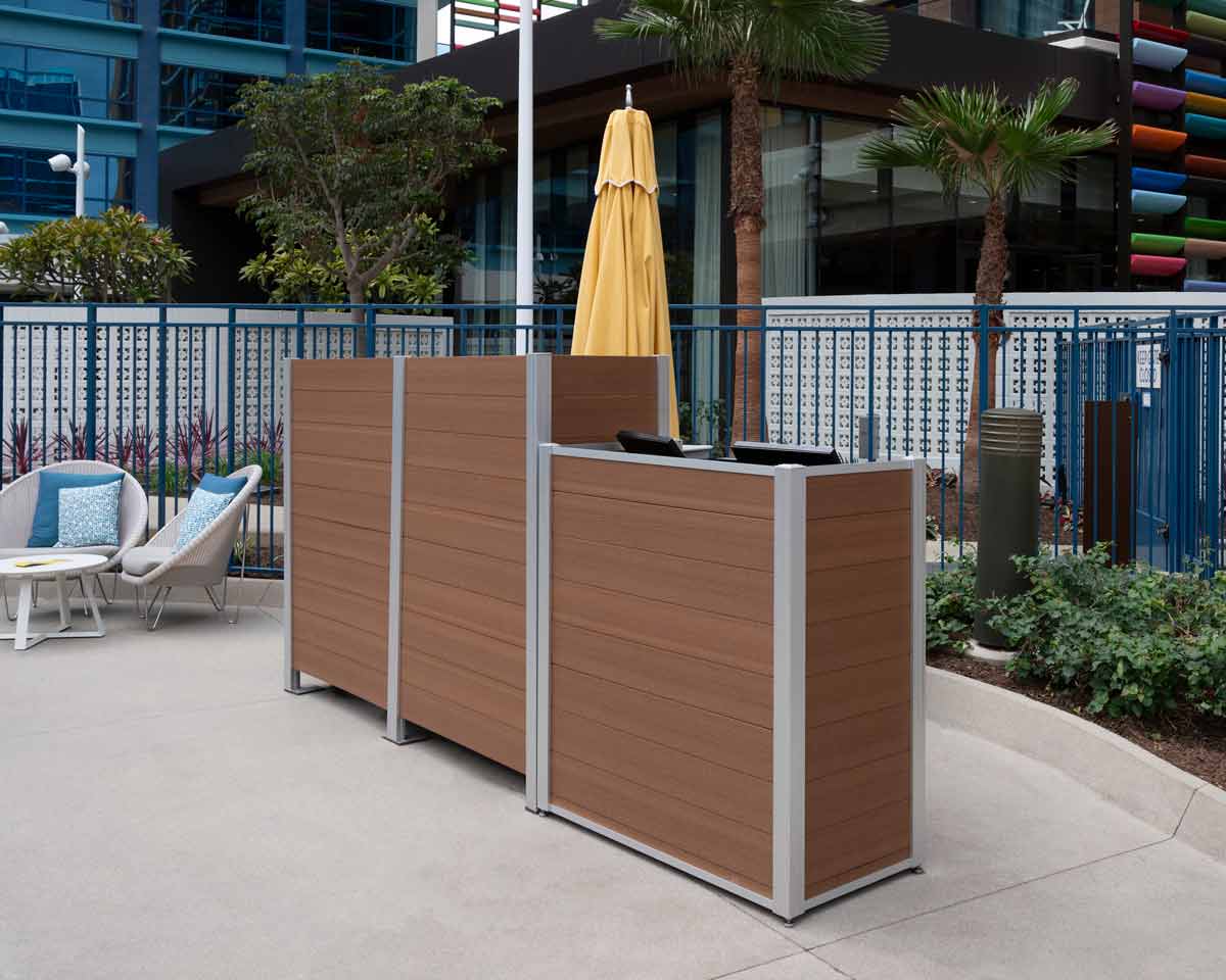 Outdoor Host Stand with POS shelf, locking door, and drawer crafted from weatherproof mahogany HDPE recycled plastic lumber with an coordinating screen wall.